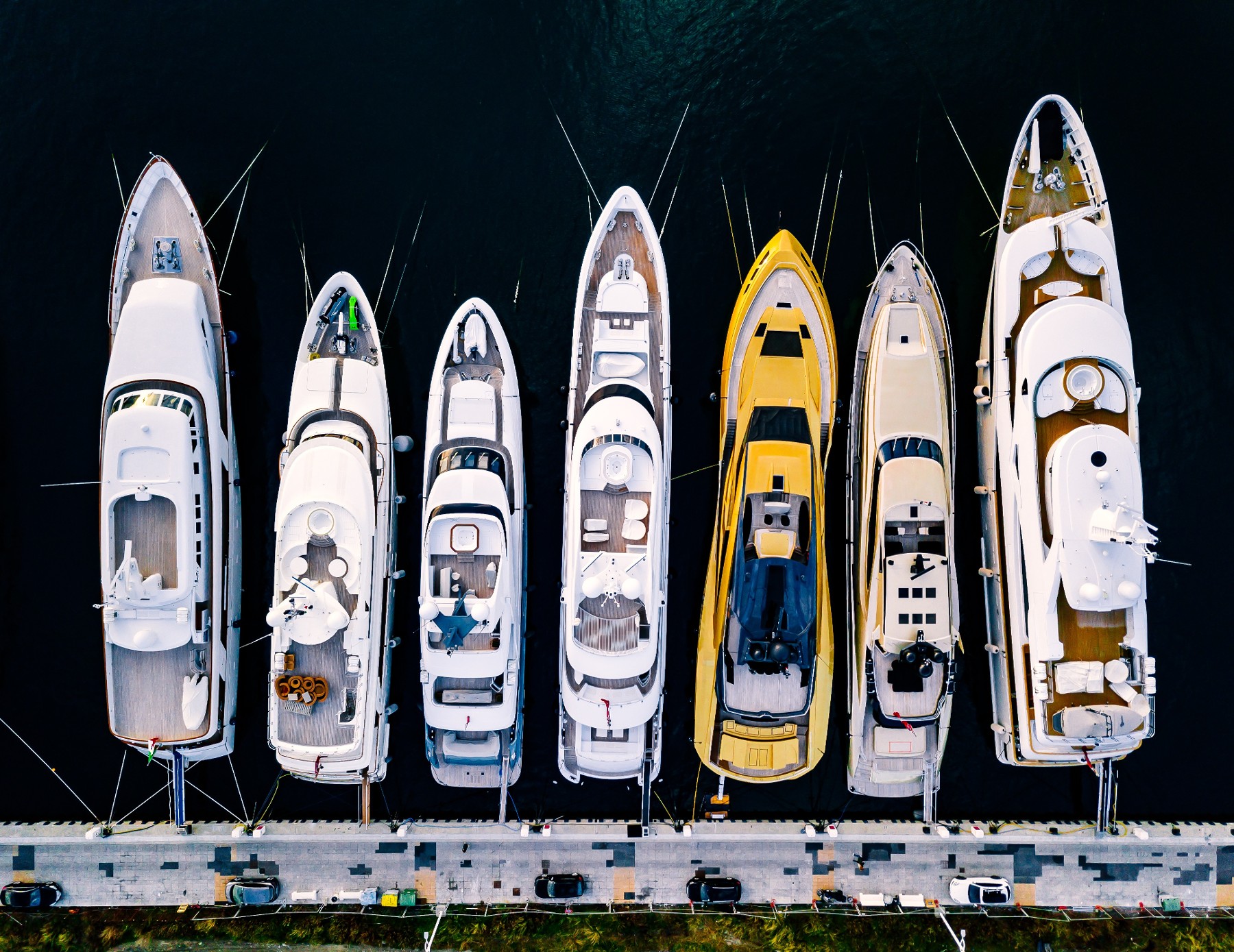 Aerial view of yachts moored side by side in marina