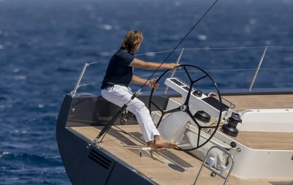 Captain at the helm of a luxury yacht