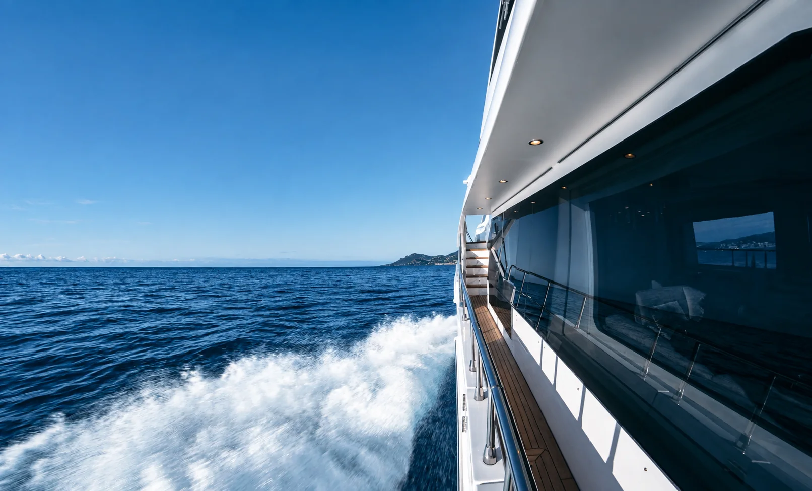 The side deck of a yacht underway in open water.