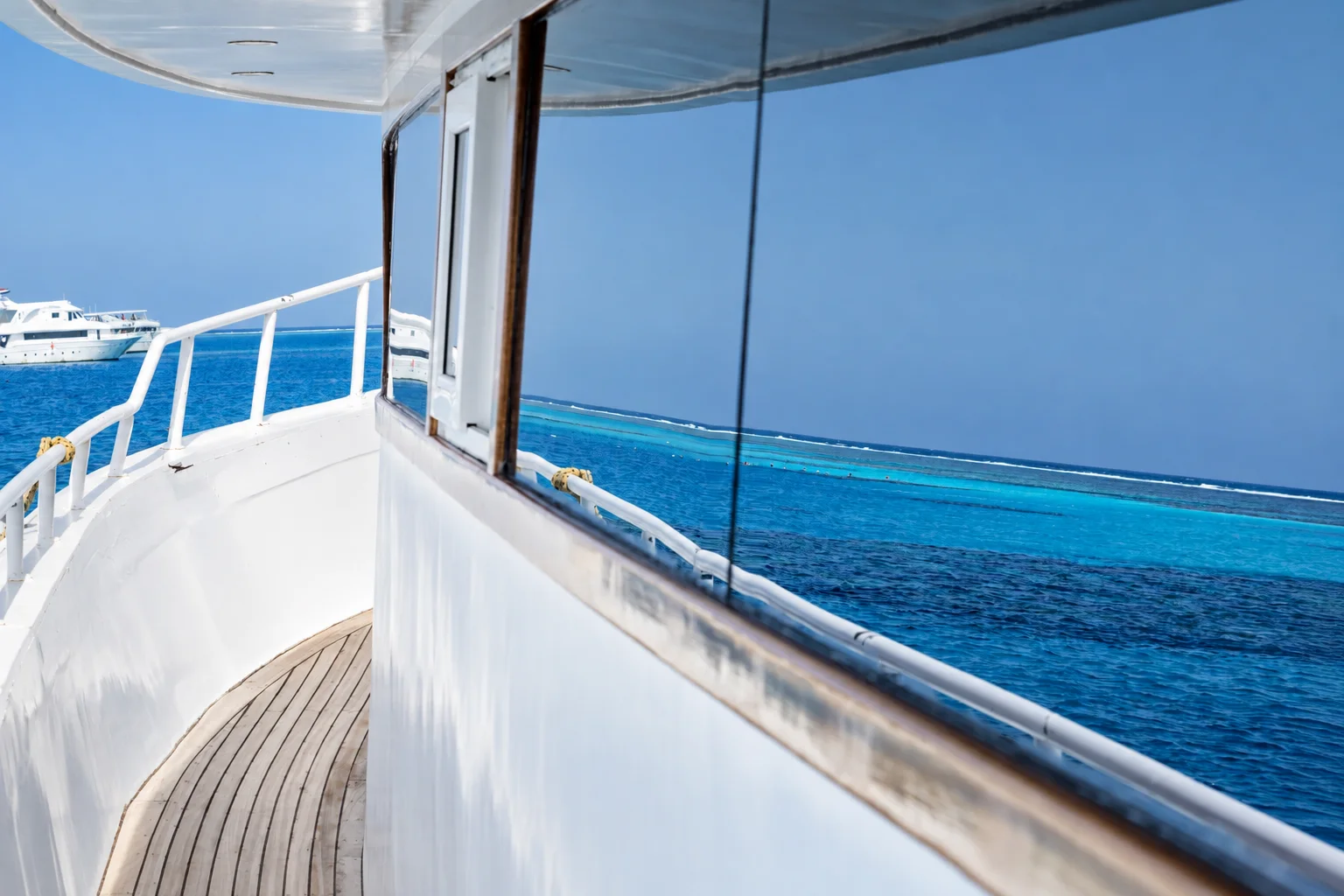 Ocean reflections moving across a yacht deck.