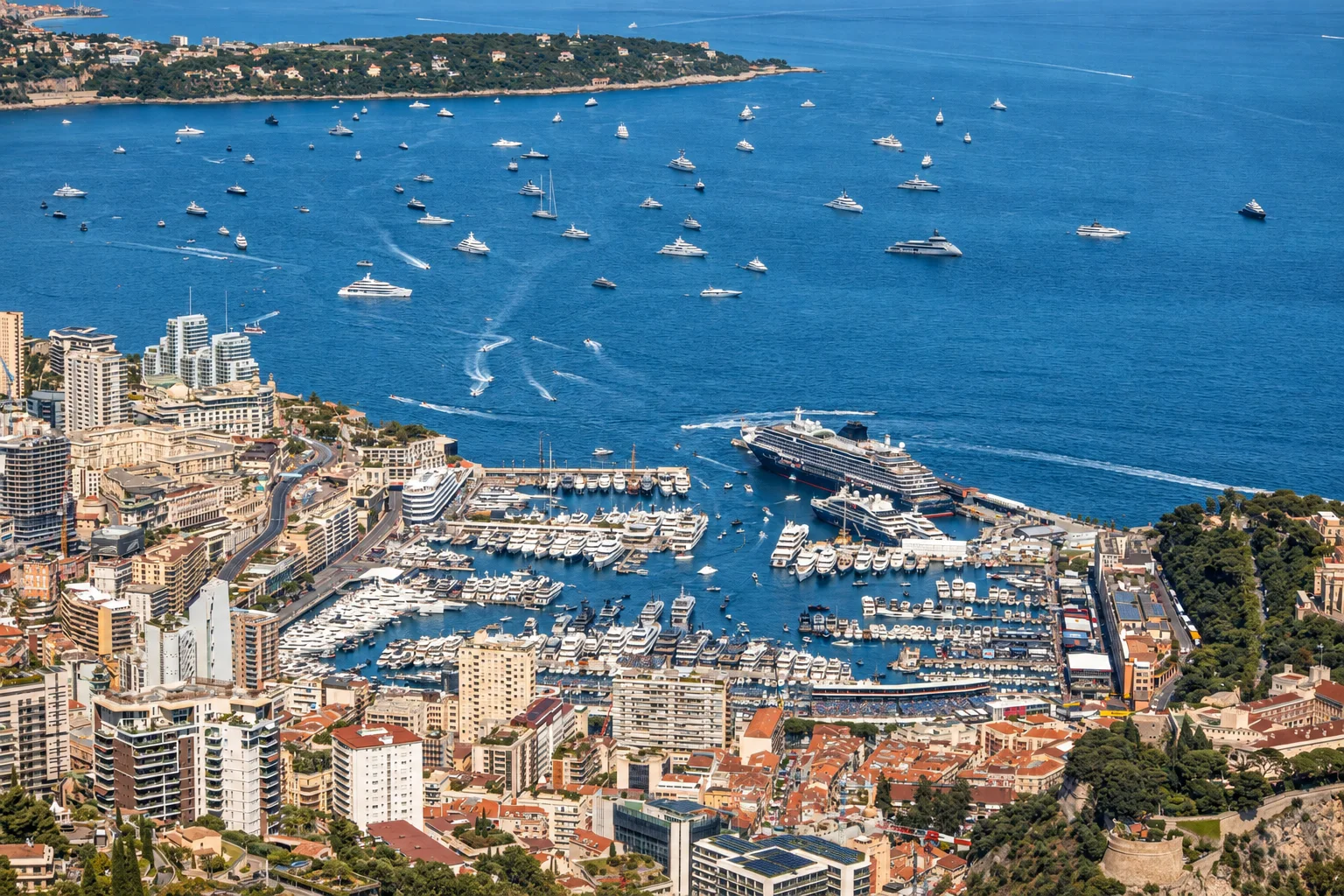 A panoramic Mediterranean harbour and the Monaco coastline.