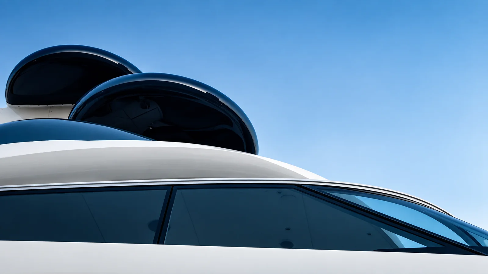 The glossy profile of a contemporary motor yacht.