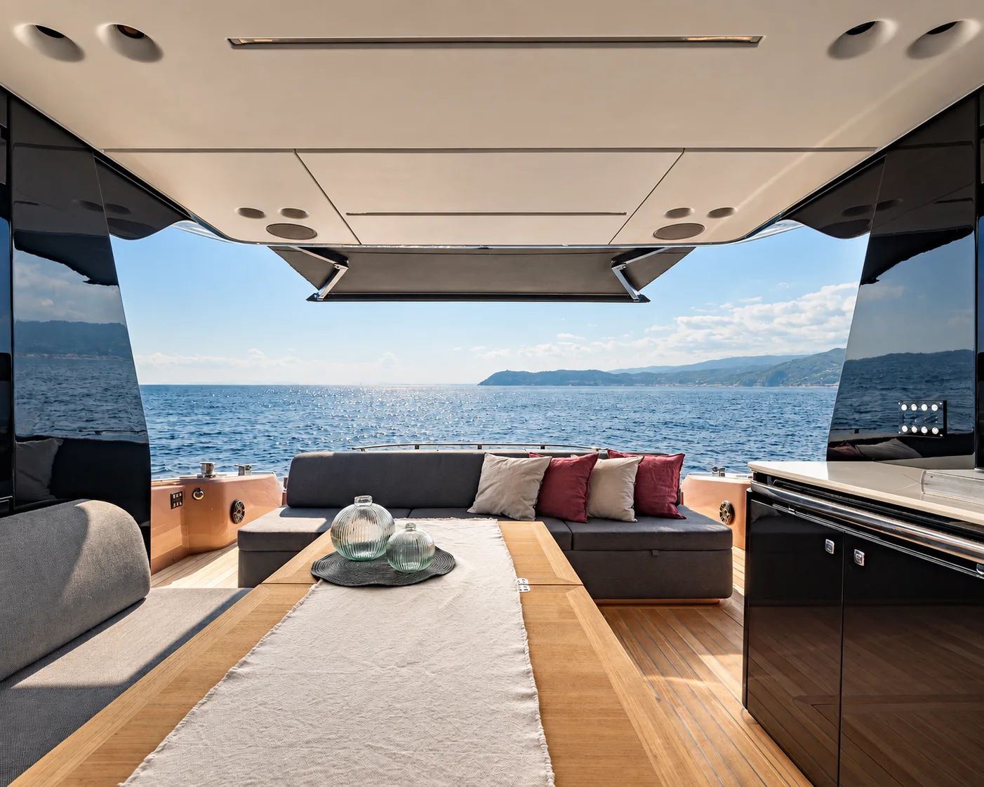 A yacht saloon overlooking the sea.