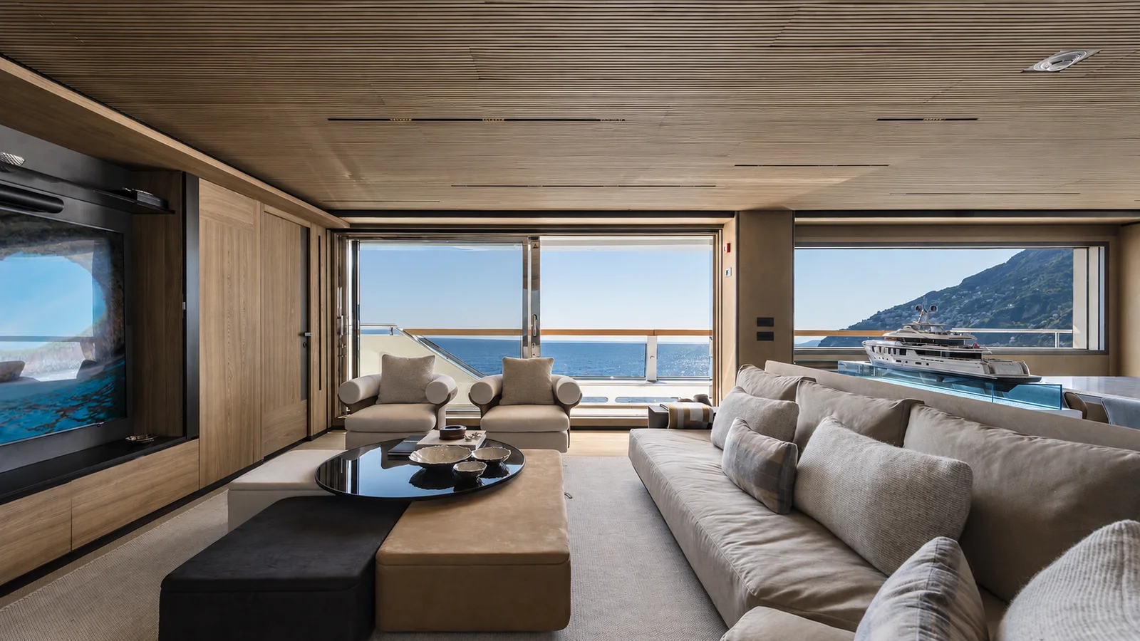 A bright lounge aboard a contemporary yacht.