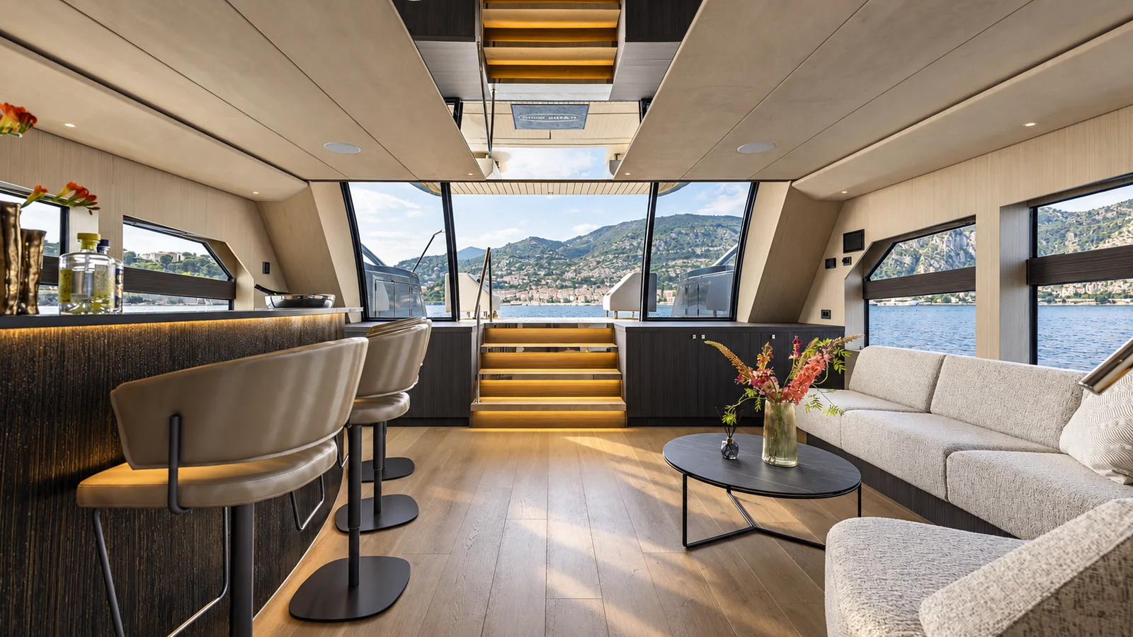 A yacht saloon with a broad view of the bay.