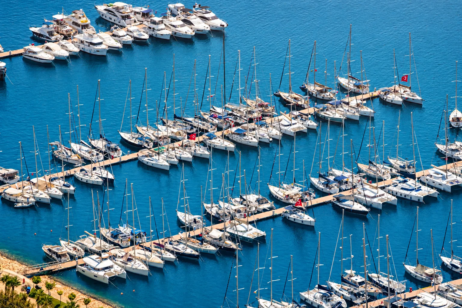 A panoramic yacht harbour filled with sailing boats.