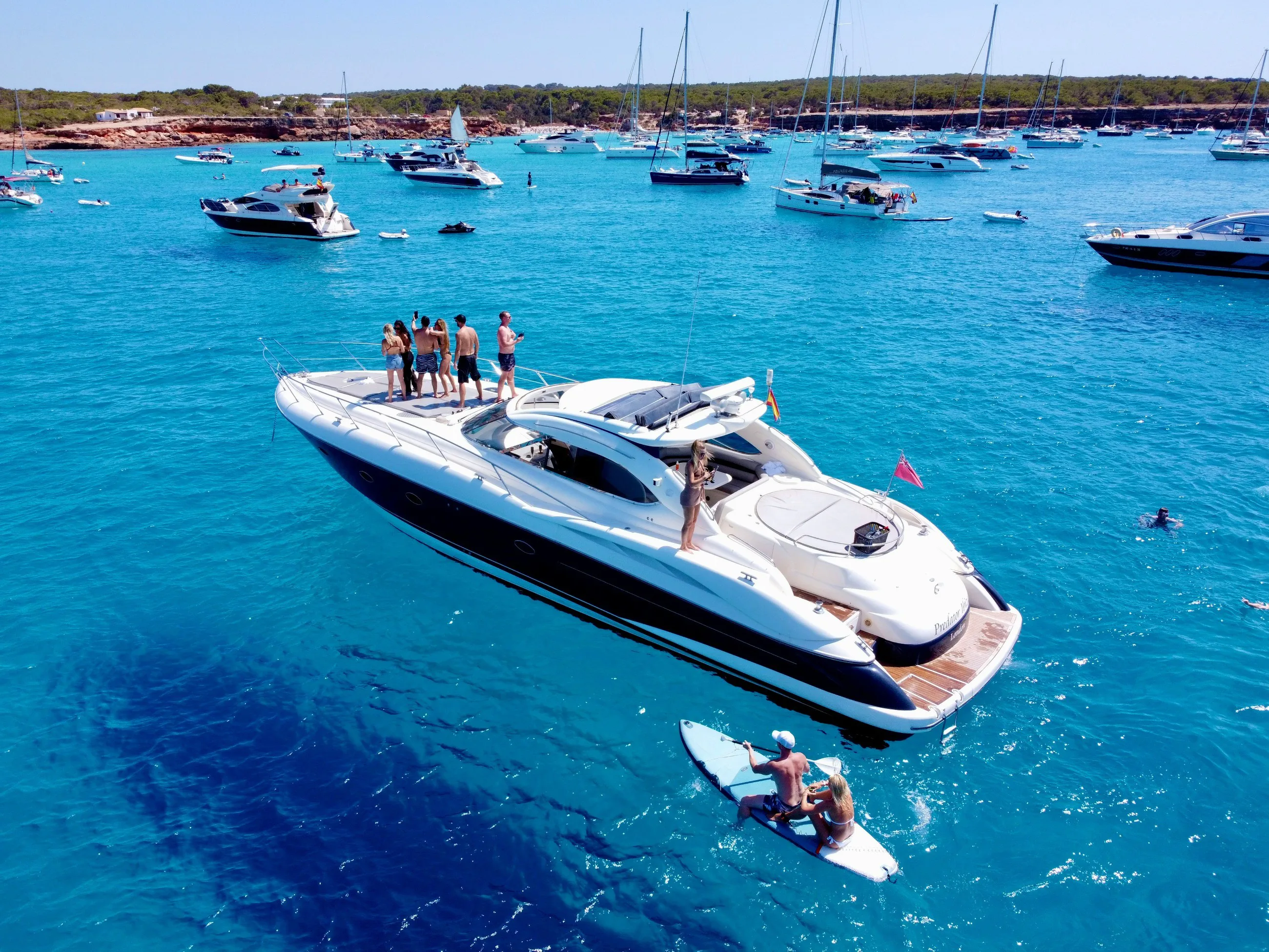 Social yacht gathering in turquoise bay