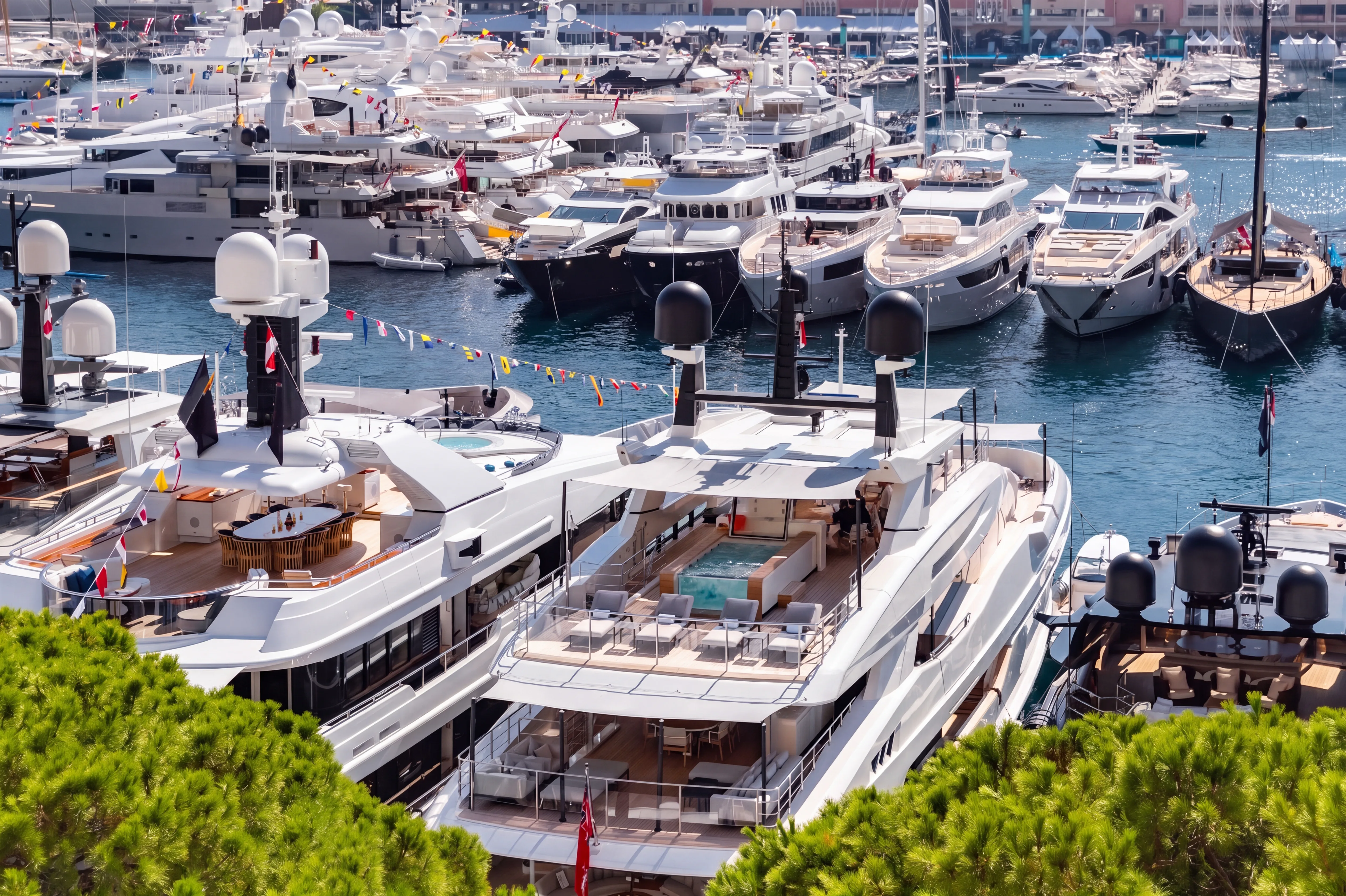 Superyacht with a helicopter on its deck at sea