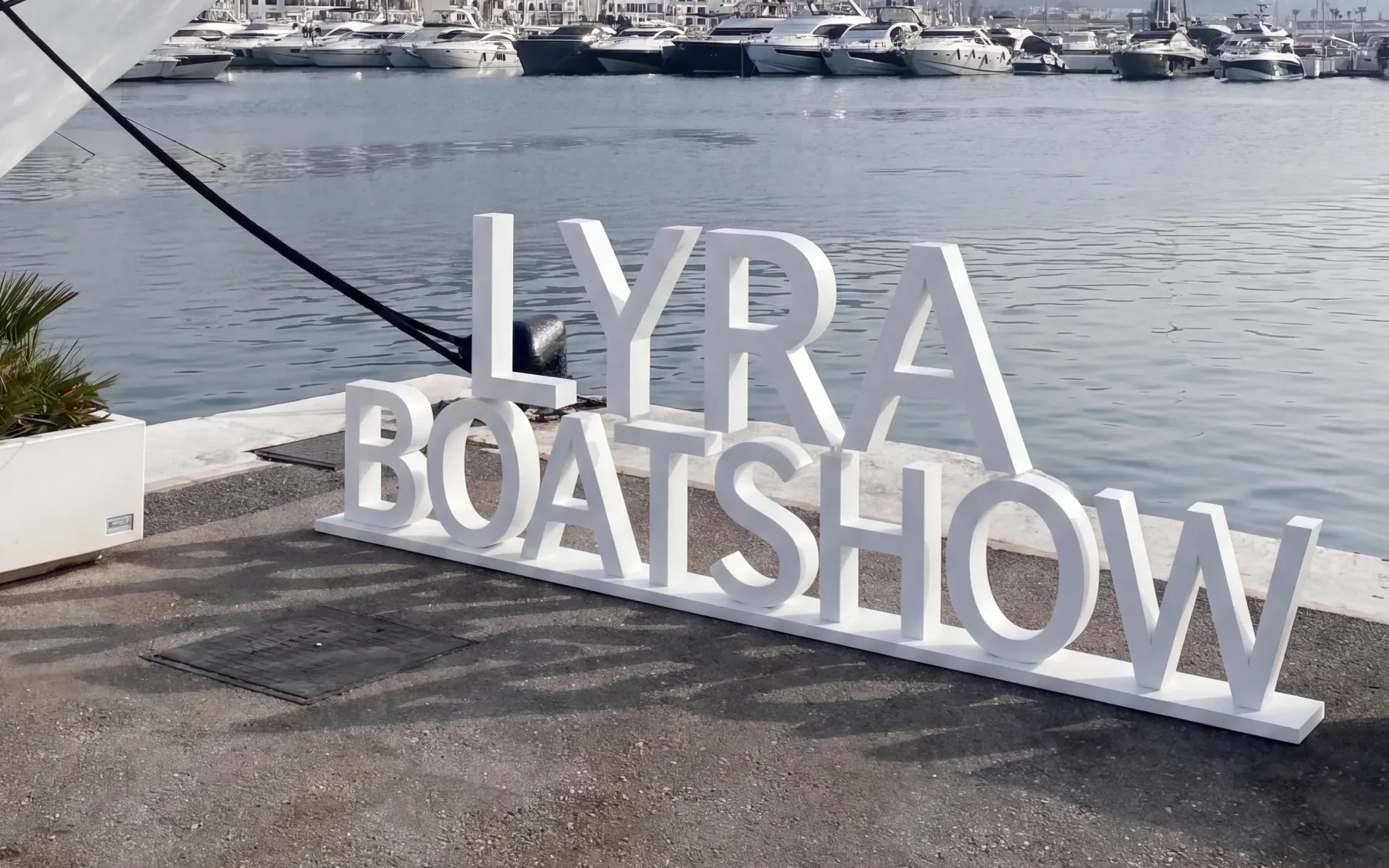 LYRA BOATSHOW lettering on the quayside in Puerto Banús